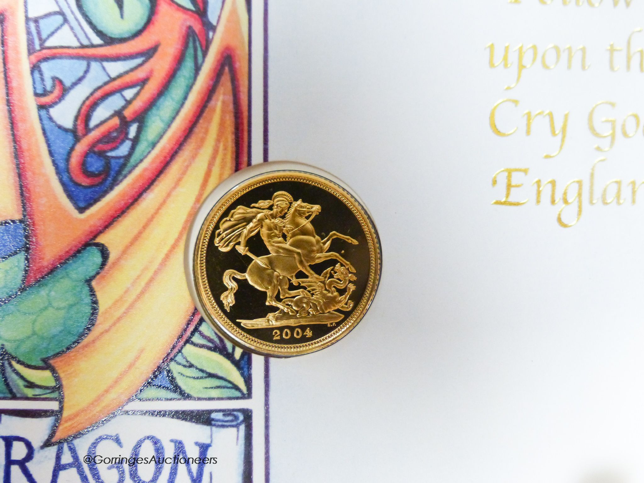 A 2004 St George and The Dragon gold sovereign with presentation cover and certificate of authenticity.